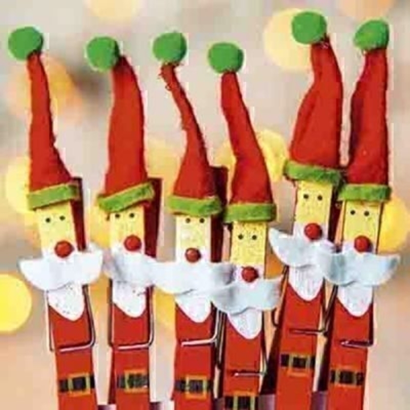 Box of 10 Charity Christmas Cards - Clothes peg Santas Comes with red envelopes. Photographic design of santas made from clothes pegs. In aid of Teenage Cancer Trust - 10% of price. 'Merry Christmas and a Happy New Year' on the inside. Christmas card siz